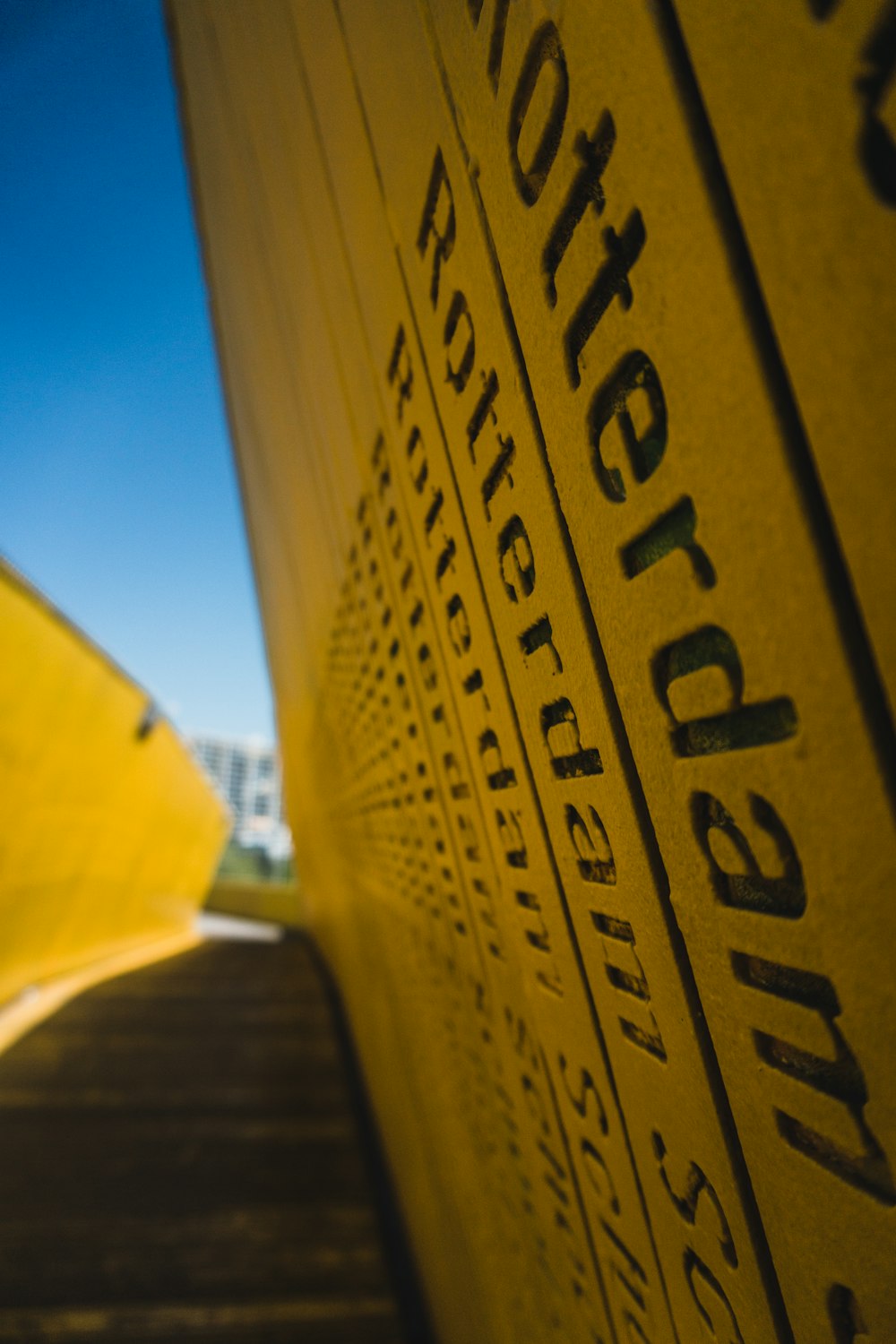 a yellow umbrella sitting on the side of a building