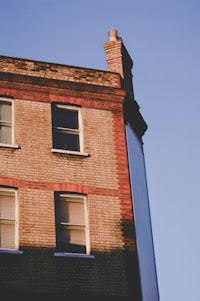 A charming brick building at 125 Cherry Street bathed in warm afternoon sunlight.