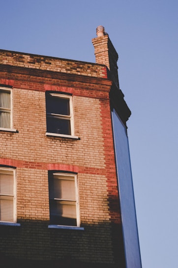 A charming brick building at 125 Cherry Street bathed in warm afternoon sunlight.