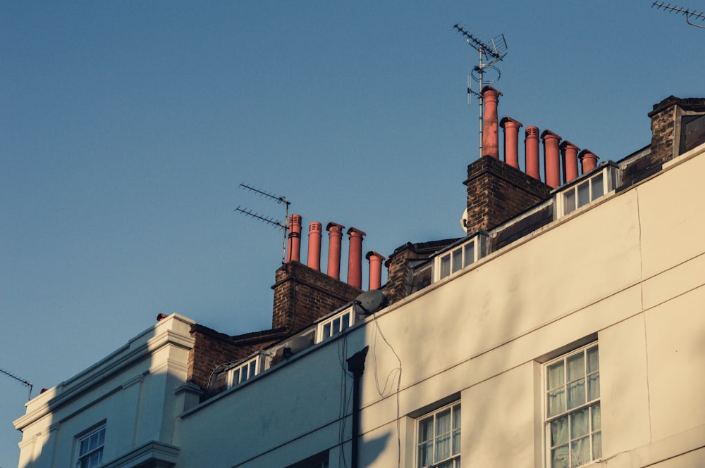 a row of chimneys on top of a building