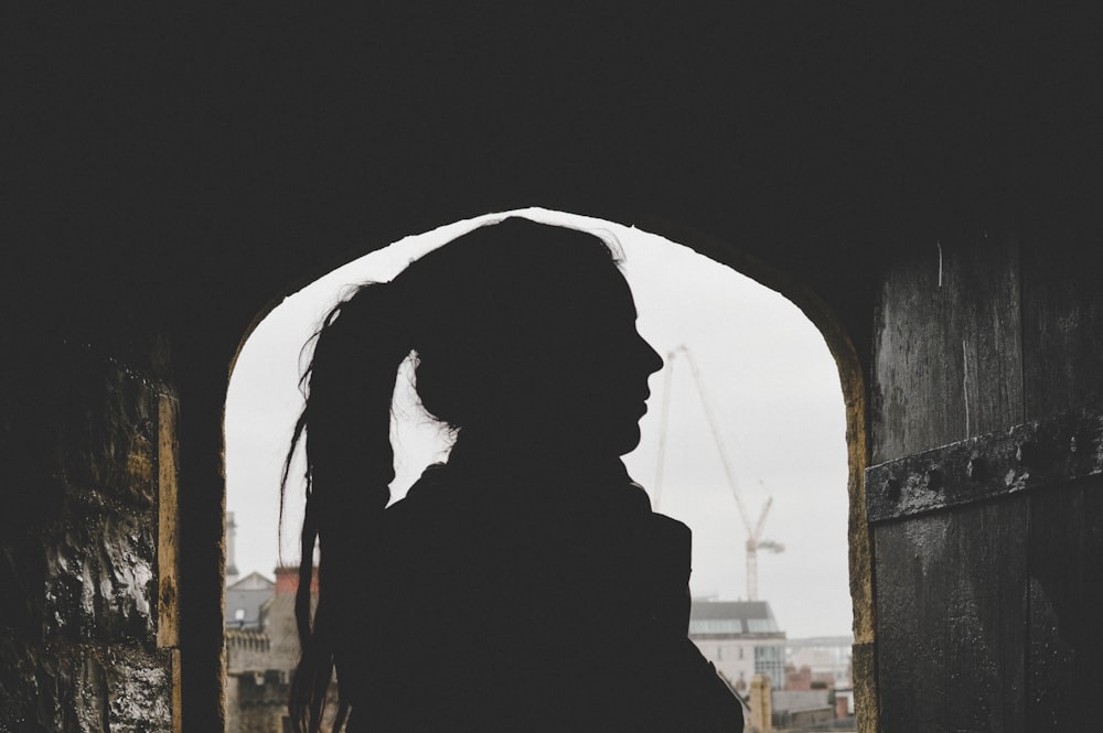 woman underneath building