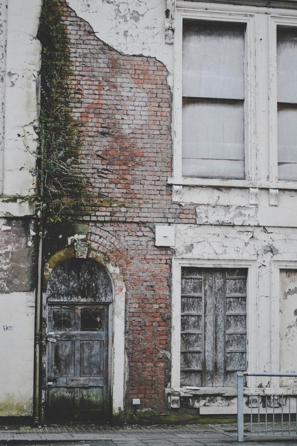 an old building with a bench in front of it