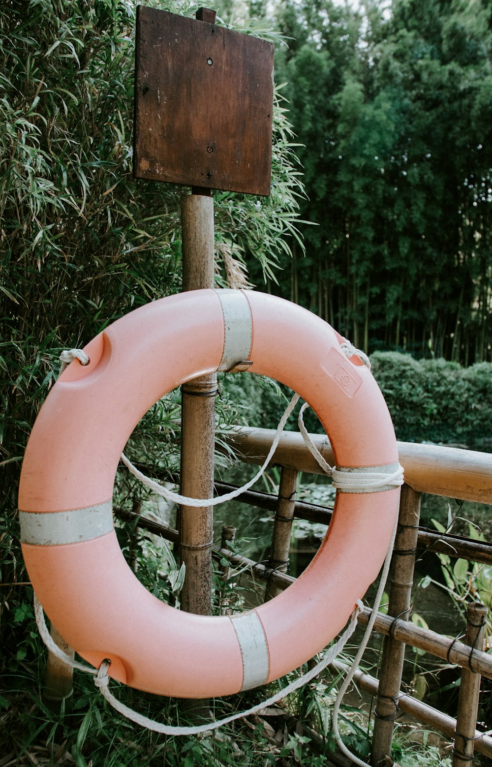 pink and white life buoy