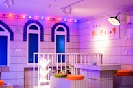 The colorful set of 'Bingo is Life' illuminated with vibrant accent lighting and whimsical decor.