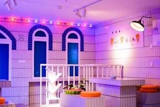 The colorful set of 'Bingo is Life' illuminated with vibrant accent lighting and whimsical decor.