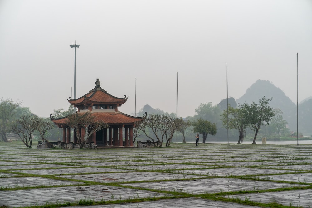 a small pavilion in the middle of a park