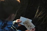 person holding photo of men