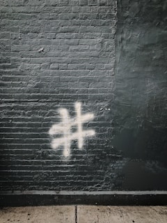 number sign painted on gray wall