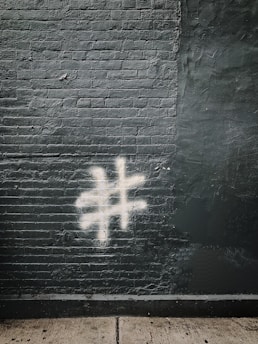 number sign painted on gray wall