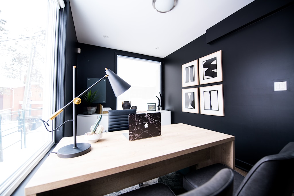 Black office table lamp on desk inside room