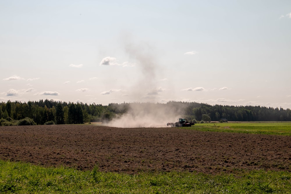 brown smokes on brown field during daytime