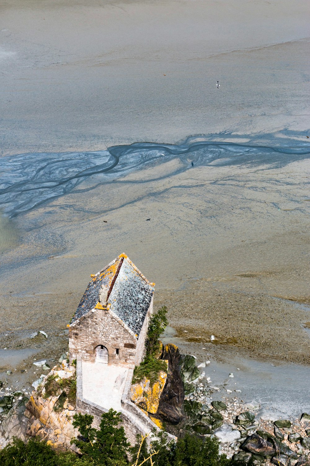 aerial view of house near sand dunes