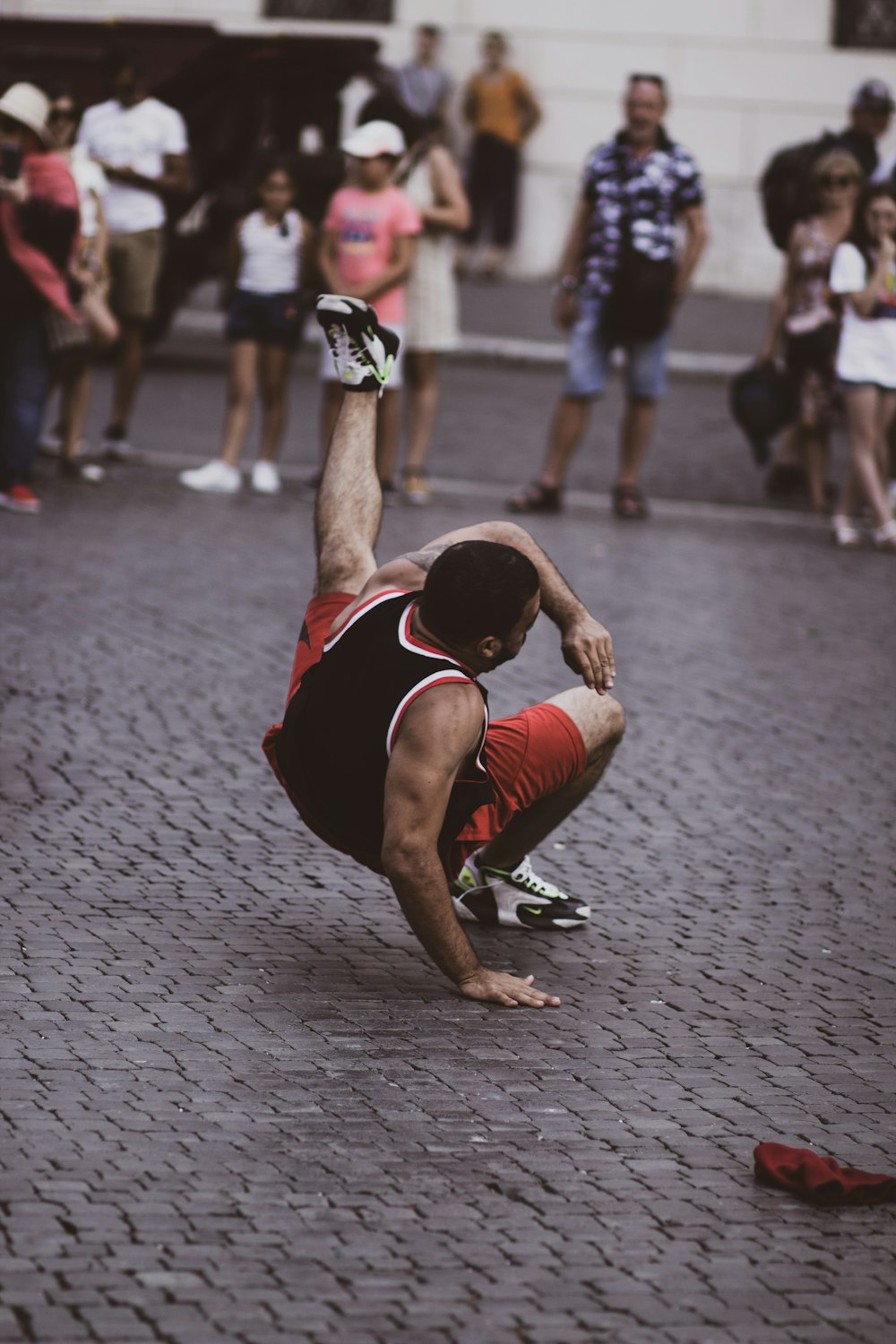 man in red and black break dancing