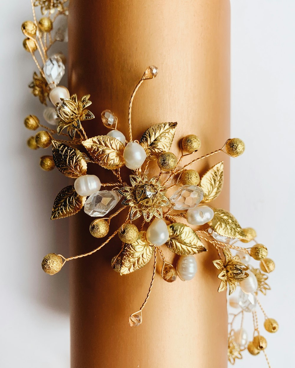 gold-colored white pearl floral accessory