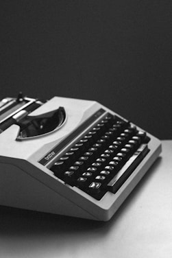 white and black typewriter close-up photography