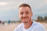 man wearing white crew-neck shirt outdoor selective focus photography