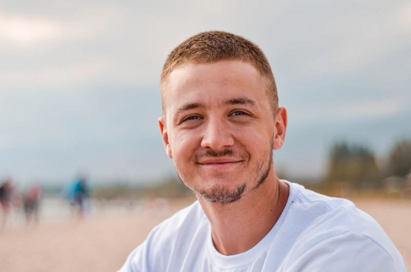 friendly older man in a white shirt outdoors