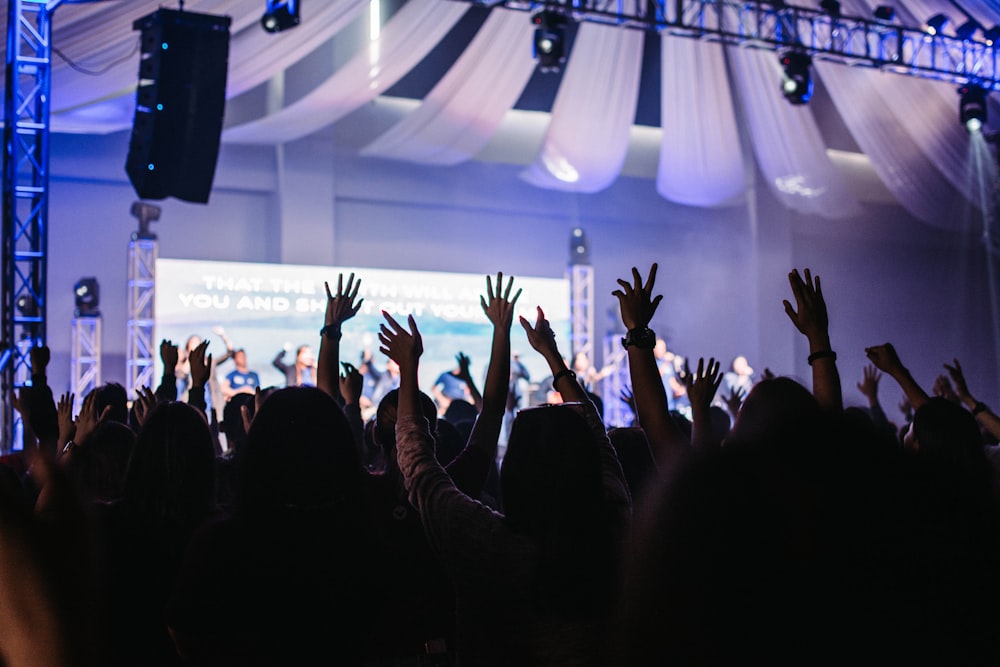 people standing near stage close-up photography