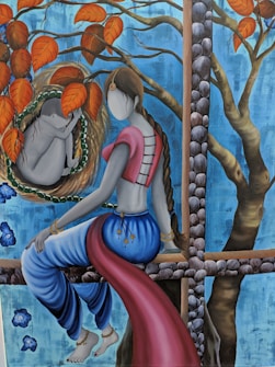 A stylized painting features a woman with long braided hair, seated and facing a cocoon-like structure on a branch. She is dressed in a traditional outfit with a blue and red ensemble. Surrounding her are vivid orange leaves and a textured blue background, giving the scene a dreamlike quality. The cocoon contains a curled figure, and the setting includes a tree with a grid-like wooden structure.