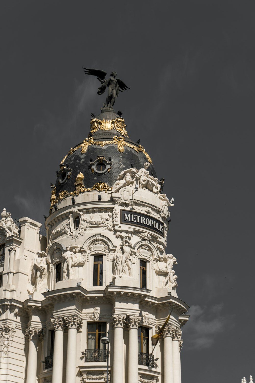 view of Gothic architecture building with statue on top