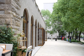 Community courtyard showing renovated walkways and seating areas with greenery.