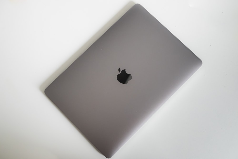 grey Apple laptop close-up photography