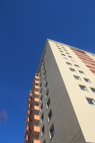 A panoramic shot of a recently completed multi-family residential building showcasing clean lines and modern design.