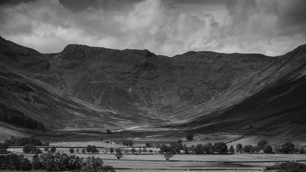 a black and white photo of a mountain range