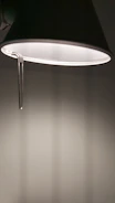 Artistic 3D rendering of a modern decorative lamp casting soft shadows.