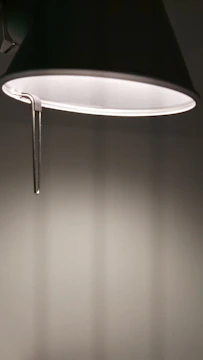 Artistic 3D rendering of a modern decorative lamp casting soft shadows.