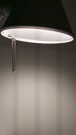 A close-up of a stylish wall lamp casting warm light in a contemporary setting.