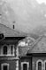 grayscale photography of house near mountain