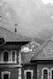 grayscale photography of house near mountain