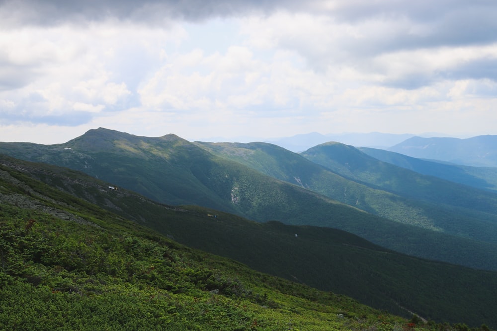 green field mountain during daytime