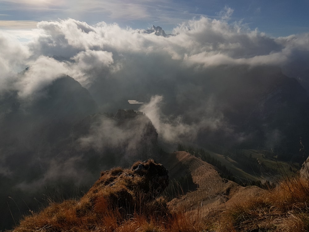 clouds over mountain during daytime