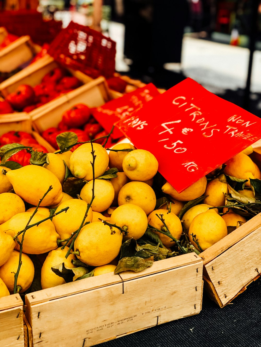 box of round yellow fruits