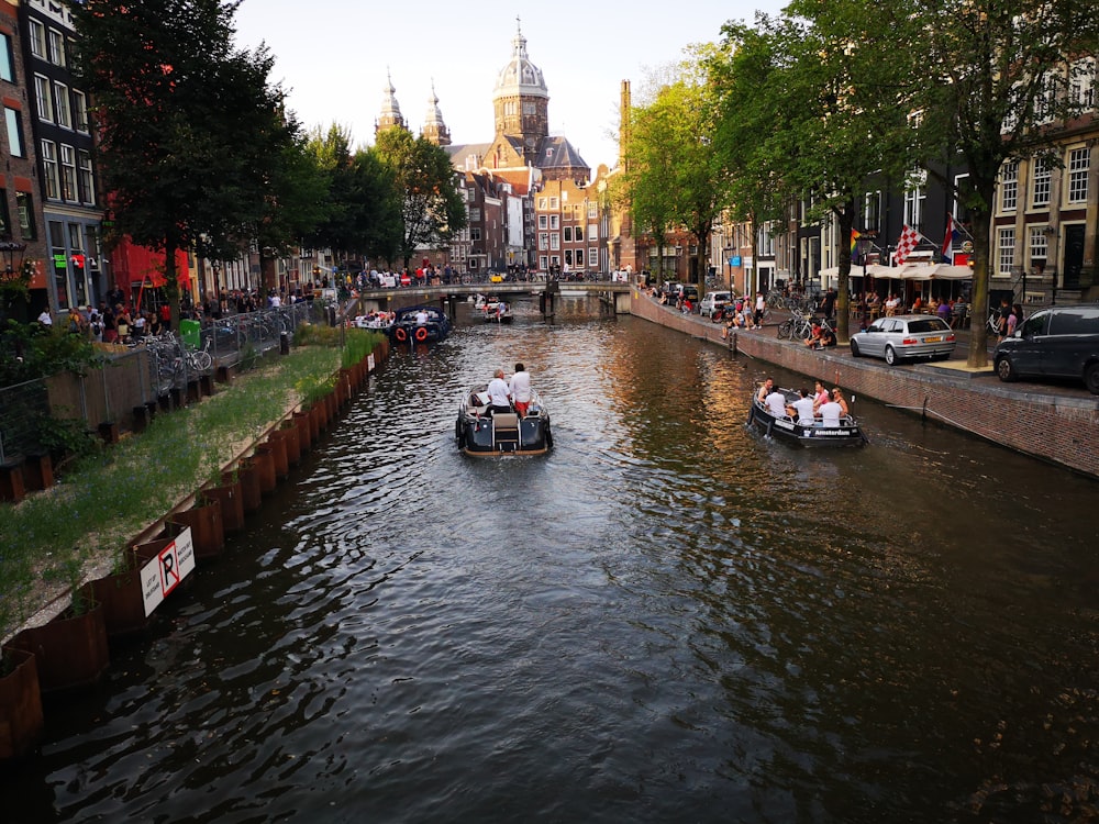 group of men riding on boat floating on river