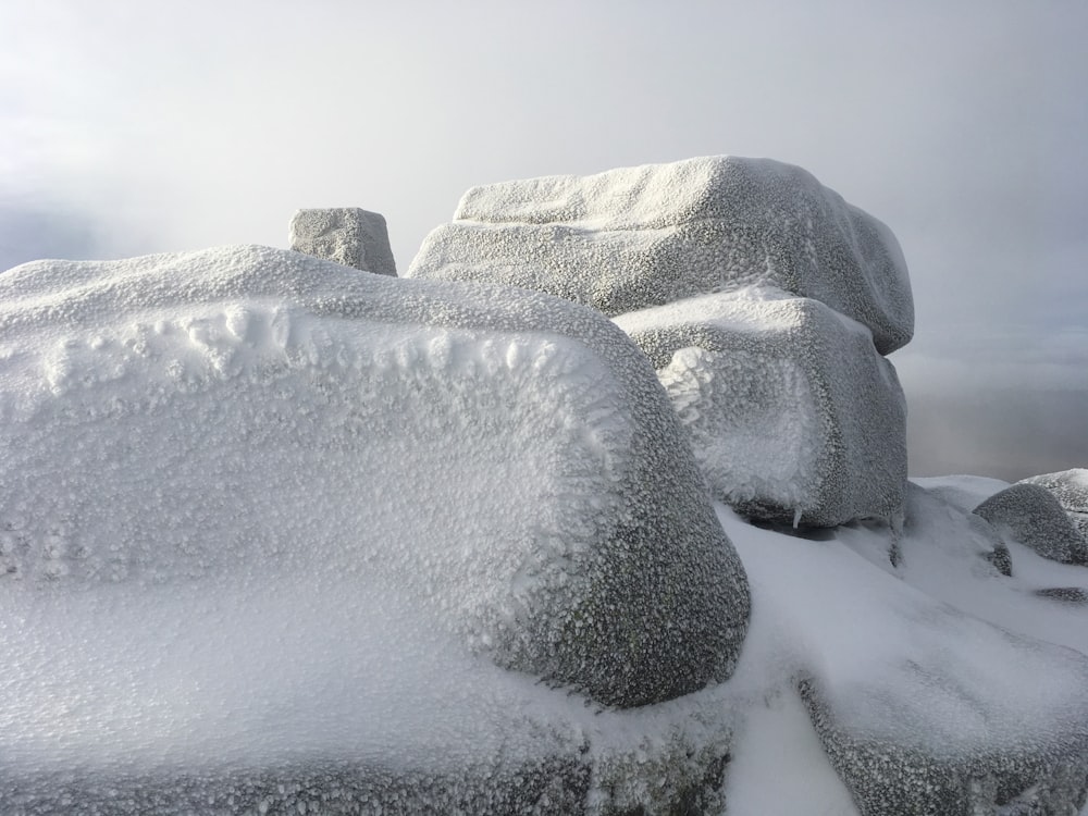 landscape photography of rocks cover with snow