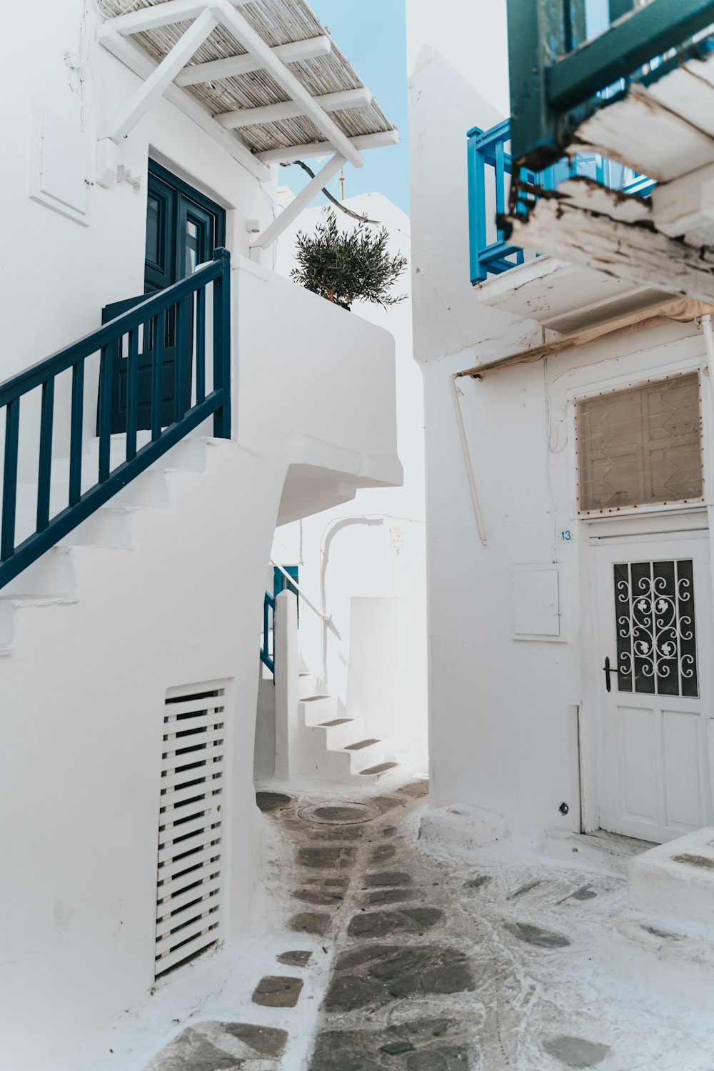 white houses with blue railings