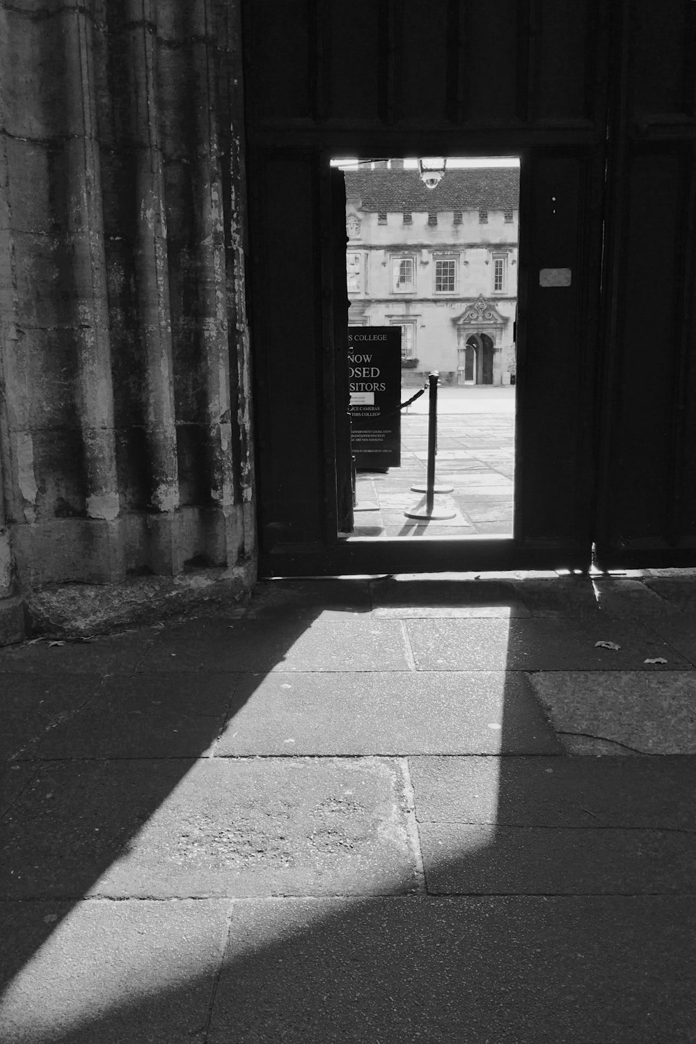 a black and white photo of an entrance to a building