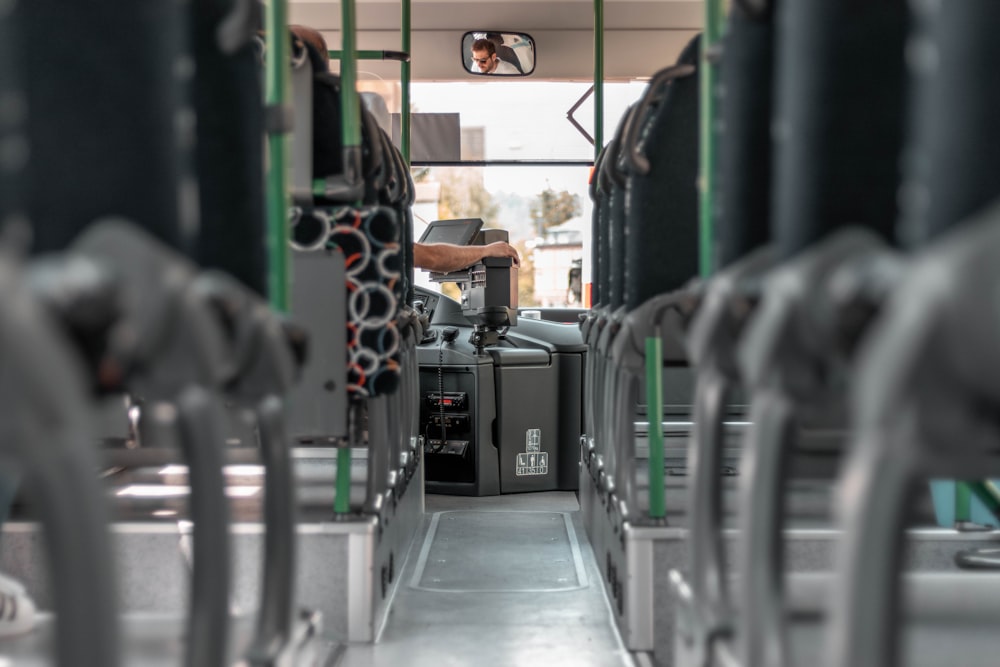 the inside of a bus with a lot of seats