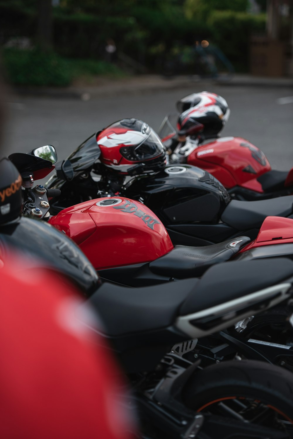 three black-and-red motorcycles