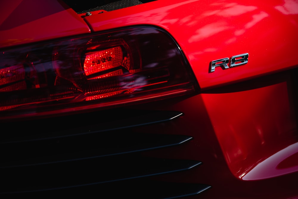 the front end of a red sports car