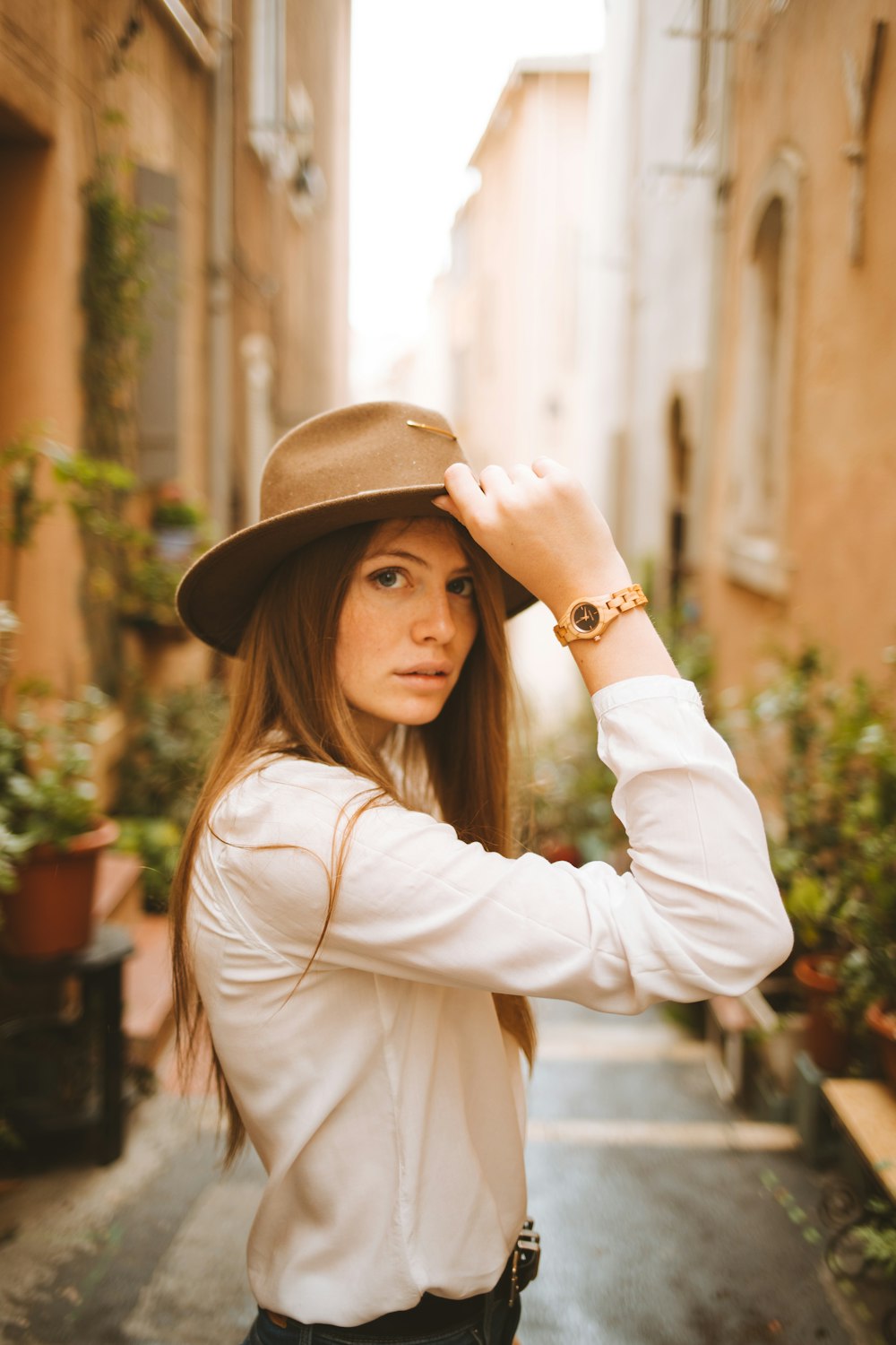 woman wearing brown hat