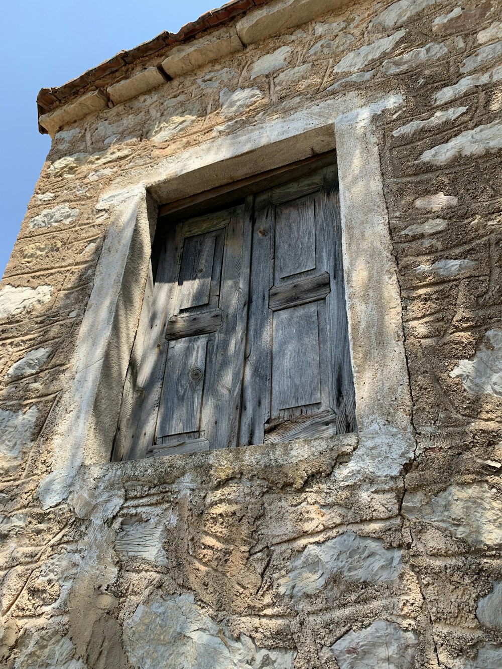 black and gray wooden window cover