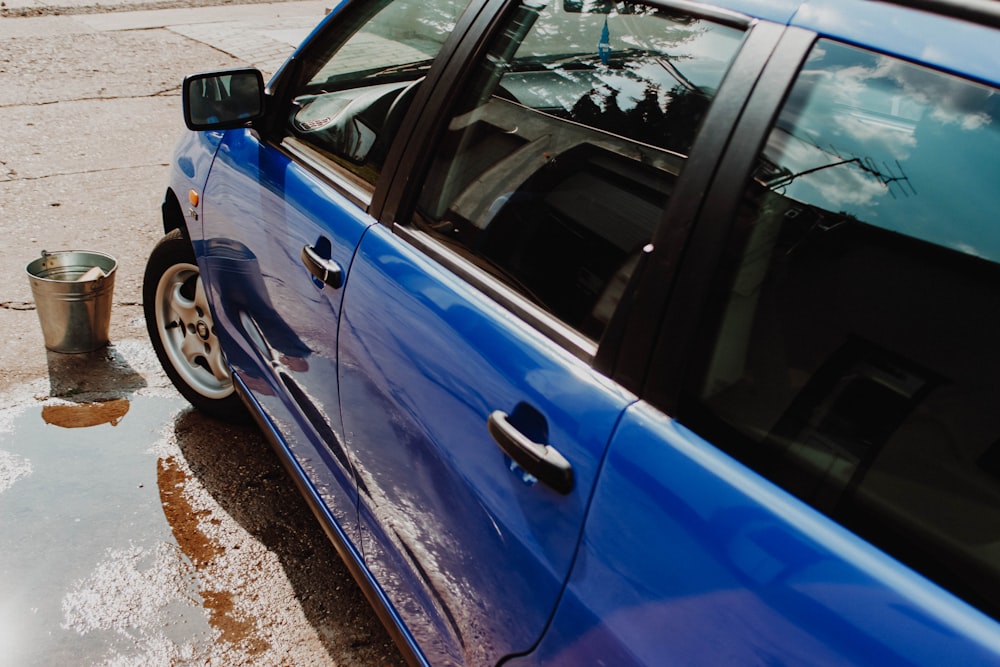 blue vehicle outdoor during daytime