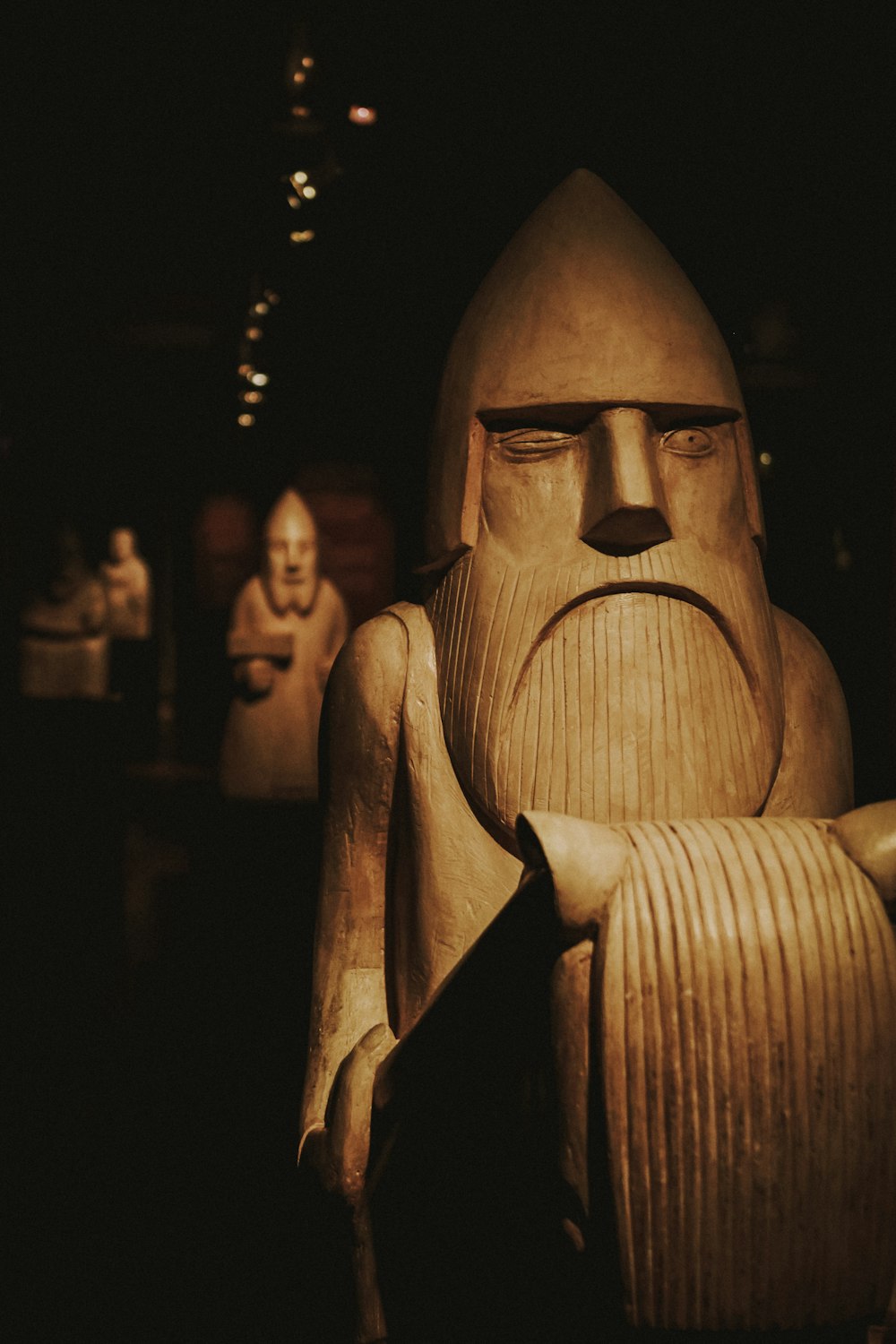 closeup photo of brown wooden statue