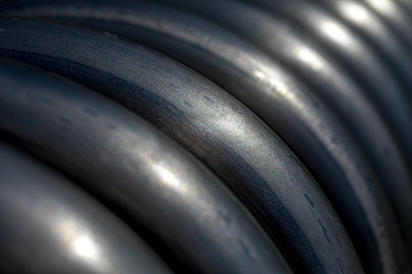 Close view of small hollow steel tubes with visible metal walls