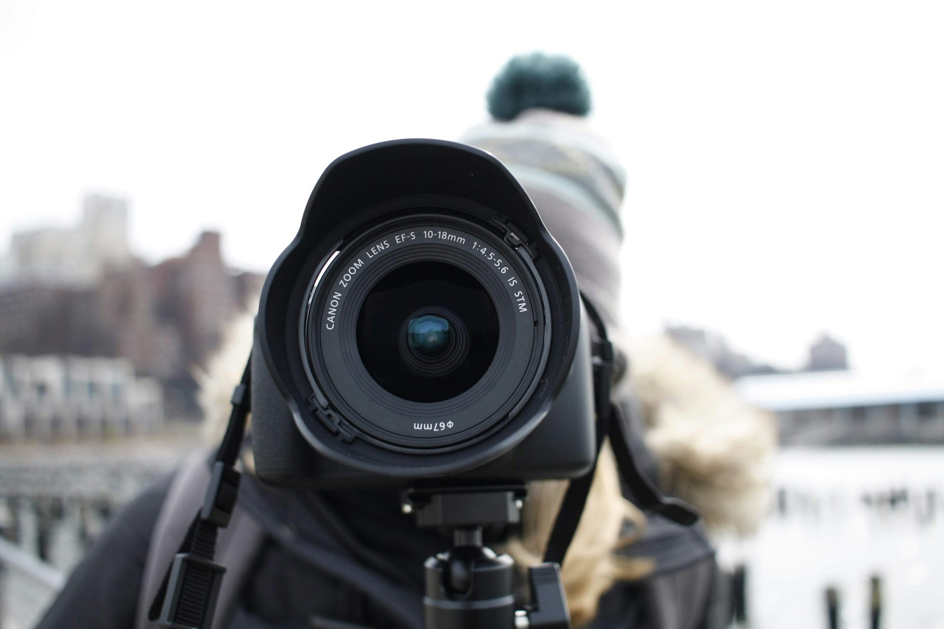 A behind-the-scenes shot of a winter-themed photo session with cozy props and snow effects.