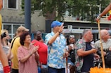 A crowd enjoying a street performance at an event.